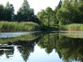 Beautiful summer landscape with calm lake, meadows, Royalty Free Stock Photo