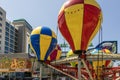 A beautiful summer landscape at the Carolina Beach Boardwalk with carnival rides and hotels with blue sky in Carolina Beach Royalty Free Stock Photo