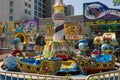 A beautiful summer landscape at the Carolina Beach Boardwalk with carnival rides, hotels and blue sky in Carolina Beach