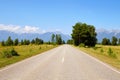 Beautiful summer landscape of the countryside. Paved road towards the mountains.