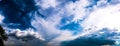 Beautiful summer landscape. Countryside with road on the field, green grass, trees and dramatic blue sky with fluffy clouds Royalty Free Stock Photo