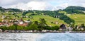 Beautiful Summer landscape of Lake Geneva, Lavaux vineyard terraces and Alps, Lutry village, Switzerland, Europe Royalty Free Stock Photo