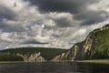 Beautiful summer landscape. river on a background of high mountains. white clouds on blue sky Royalty Free Stock Photo