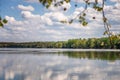 Beautiful summer landscape. River and green hills, clouds reflected in the water Royalty Free Stock Photo