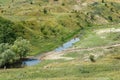 Beautiful summer landscape, river in hilly green terrain Royalty Free Stock Photo