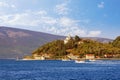 Beautiful summer Mediterranean landscape. Montenegro, Bay of Kotor. View of Kamenari town and Church of Sveta Nedjelja Royalty Free Stock Photo
