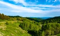 Beautiful summer mountain landscape with blue smoke and forest. Kazakhstan Almaty, Aktas Plateau and Bukreev Peak. Royalty Free Stock Photo