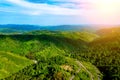 Beautiful summer mountain landscape with blue smoke and forest. Kazakhstan Almaty, Aktas Plateau and Bukreev Peak. Royalty Free Stock Photo