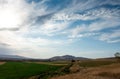 Beautiful summer mountain landscape. Wheat fields and mountains. Kyrgyzstan. Natural background Royalty Free Stock Photo