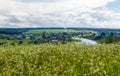 Beautiful summer rural landscape with river and clouds on blue sky. Russia. Ural. Village Sloboda Royalty Free Stock Photo