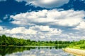 Beautiful summer rural landscape with river and clouds on the blue sky. Russia. Ural. Village Sloboda Royalty Free Stock Photo