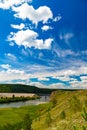 Beautiful summer rural nature landscape. Sunny view of blue river and green meadows with trees on a background. Summer Royalty Free Stock Photo
