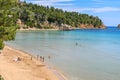 Beautiful Summer scenery with a lot of swimmers at Chrisi Milia beach in Alonissos island, Greece