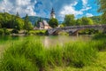 Alpine church and stone bridge over lake Bohinj, Slovenia