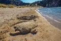 Close-up of a handmade sand sculpture of a Sea turtle at Voidokoilia beach reminds the Sea Turtle Protection in Romanos, Greece Royalty Free Stock Photo