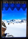 Beautiful summer scenic view on snowy Swiss Alps in sunny blue sky, window frame in foreground, Jungfrau Region, Bernese Oberland Royalty Free Stock Photo