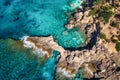 Beautiful summer seascape from air. Turquoise sea water with waves and rocks from top view Royalty Free Stock Photo