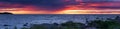 Beautiful summer seascape panorama during drammatic sunset. Royalty Free Stock Photo