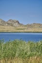 Beautiful panoramic summer steppe landscape of stone mountains