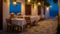 Beautiful summer street cafe the evening in Greece Royalty Free Stock Photo