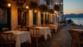 Beautiful summer street cafe in the evening in Greece Royalty Free Stock Photo