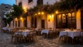 Beautiful summer street cafe the evening in Greece terrace vacation holiday Royalty Free Stock Photo