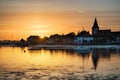 Beautiful Summer sunset landscape over low tide harbor with moor