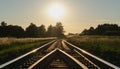 a beautiful summer sunset over the empty railroad tracks running through colorful meadows. scenery. Royalty Free Stock Photo