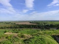 Beautiful summer valley with forest and river and blue sky with clouds