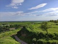 Beautiful summer valley with forest and river and blue sky with clouds