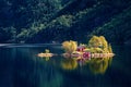 Beautiful summer view of small island with typical Norwegian building on Lovrafjorden flord, North sea. Colorful morning view in