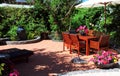 Beautiful summertime Mediterranean style courtyard garden setting. Royalty Free Stock Photo