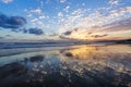 Beautiful summertime view seascape. The wet sand on the sea coast. Unbelievable sunrise. Morning landscape. High waves with foam. Royalty Free Stock Photo