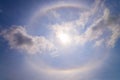 beautiful sun halo with circular rainbow around sun behide blue Royalty Free Stock Photo