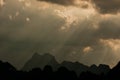 Beautiful sun rays through the clouds over mountains,evening light,Amazing scene at Khao-Sok National Park of Thailand Royalty Free Stock Photo