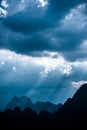 Beautiful sun rays through the clouds over mountains,evening light,Amazing scene at Khao-Sok National Park of Thailand Royalty Free Stock Photo