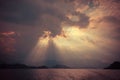 Beautiful sun rays through the clouds over mountains,evening light,Amazing scene at Khao-Sok National Park of Thailand Royalty Free Stock Photo