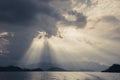 Beautiful sun rays through the clouds over mountains,evening light,Amazing scene at Khao-Sok National Park of Thailand Royalty Free Stock Photo