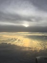 Beautiful sun set on the plane clouds grey yellow