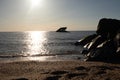 Beautiful sun setting on the ocean at Sunset Beach in Cape May New Jersey. Sunken ship off the coast looks like a silhouette. Royalty Free Stock Photo