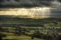 Beautiful sunbeams over Big Moor in the Peak District landscape