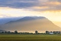 Beautiful sunbeams over the mountains in the evening