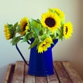 Beautiful sunflower bouquet in enamel jug Royalty Free Stock Photo