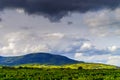 Beautiful sunlight over vineyards with blue sky and mountains on Royalty Free Stock Photo