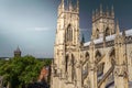 Beautiful sunlit view of the spires of York Minster Cathedral with the town in sight in Yorkshire, England