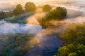 Beautiful sunny dawn landscape. Rural area, river curve at sunrise on foggy morning Royalty Free Stock Photo