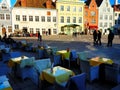 Street Cafe Tables Spring Day  in the City Street Bright Sunshine Day in Old Town of Tallinn  Baltic blue sky  travel t Royalty Free Stock Photo