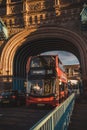 Beautiful sunny evening sunset view of the Red Bus on Tower Bridge with the cloudy blue sky Royalty Free Stock Photo