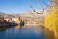 Beautiful sunny landscape, blue sky, yellow trees and ancient city reflected in river water. Bosnia and Herzegovina, Trebinje city Royalty Free Stock Photo