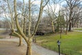 Beautiful Sunny Morning in a Park. Natural Landscape with a System of Walkways, Roads and Bridges  through Bare Trees. Royalty Free Stock Photo